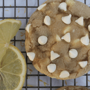 Lemon sugar cookie loaded with white chocolate chips on a cooling wrack